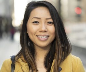 Young Asian woman in city smile happy face portrait